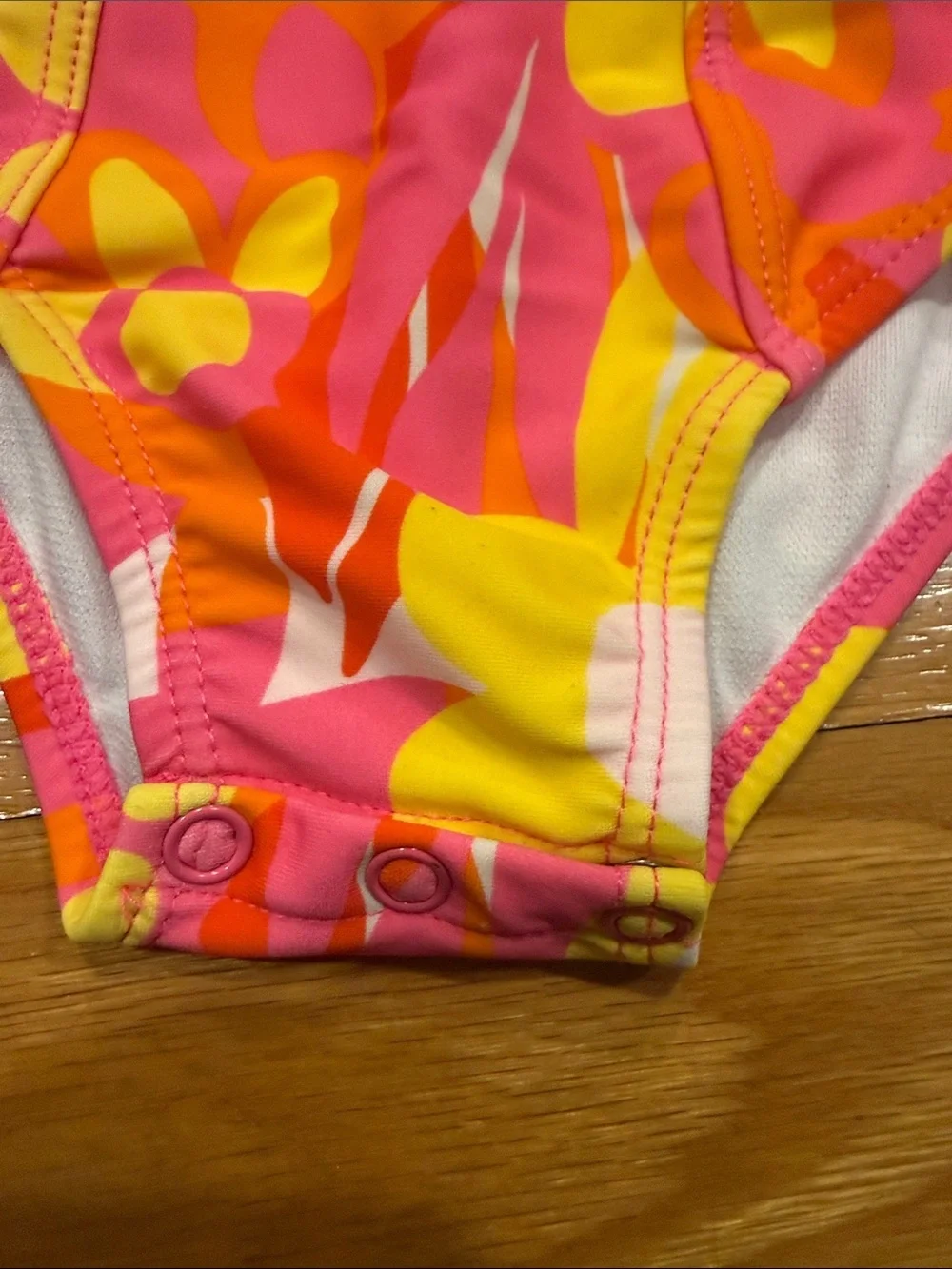 Snapper rock floral with ruffles one piece swimsuit size 18-24. Months .